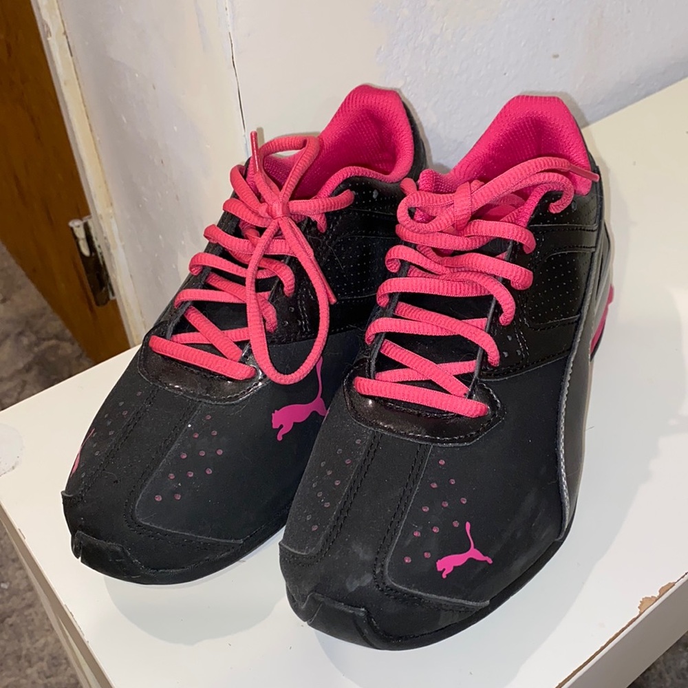 pink and black pumas